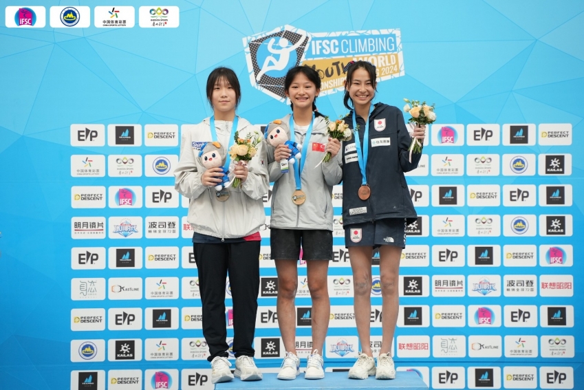 Li Meini (M) wins the gold medal in the youth b female's boulder event.